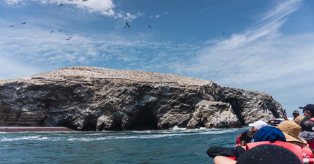Unrecognizable people on boat sightseeing in the Ballestas Islands at Paracas, Ica Peruの写真素材
