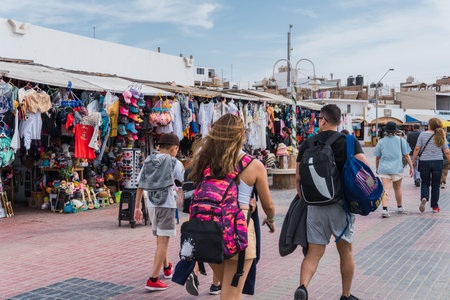 unrecognizable people walking in El Chaco boulevard, Ica Peru, looking for souvenirsの写真素材