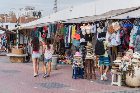 unrecognizable people walking in El Chaco boulevard, Ica Peru, looking for souvenirsの写真素材