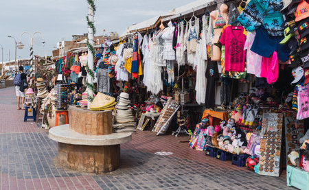 unrecognizable people walking in El Chaco boulevard, Ica Peru, looking for souvenirsの写真素材