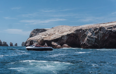 Unrecognizable people on boat sightseeing in the Ballestas Islands at Paracas, Ica Peruの写真素材