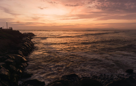 Scenic view of a beautiful sunset in Miraflores Costa Verde, Lima Peru.