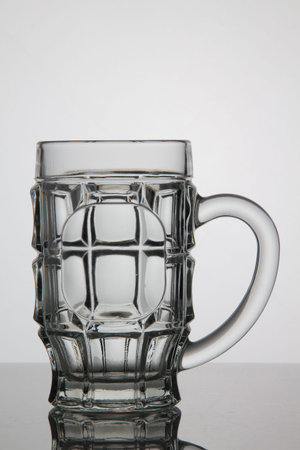 Empty glass of beer on white backgroundの写真素材