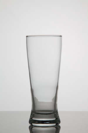 Empty glass of beer on white backgroundの写真素材