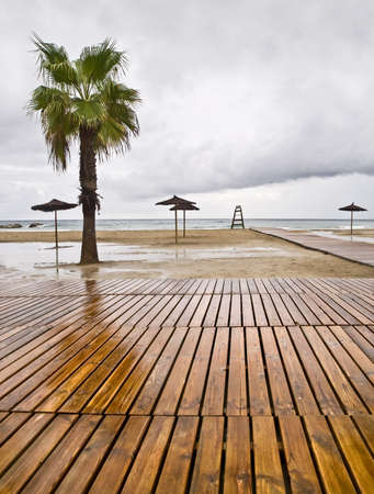 Empty beach in a rainy day. End of summer seasonの写真素材