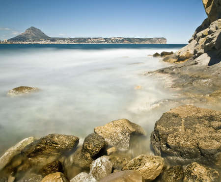 Beautiful rocky beach called Cala Sardinera, located in the Costa Blanca of Spain.の写真素材