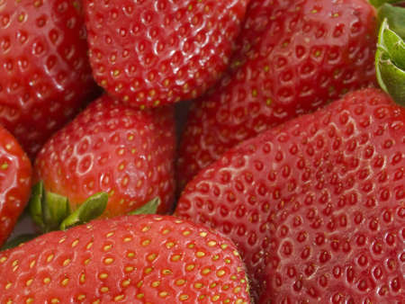 Strawberry background. Focus in the fruit of the foregroundの写真素材