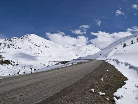 Road leading to a beautiful snowy landscapeの写真素材