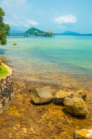 brown rock seashore with turquoise color sea in Maak island in Trad province, Thailandの写真素材