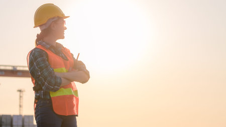 Young Caucasian man and woman worker Check and control loading freight Containers by use radio...