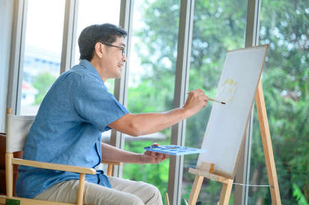 Retired Asian elderly people are resting, painting, hobbyの写真素材