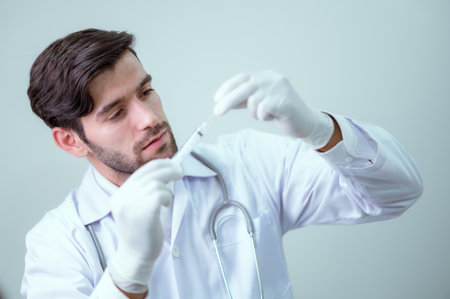Doctor looking at virus vaccine information, modern medical studies.の写真素材
