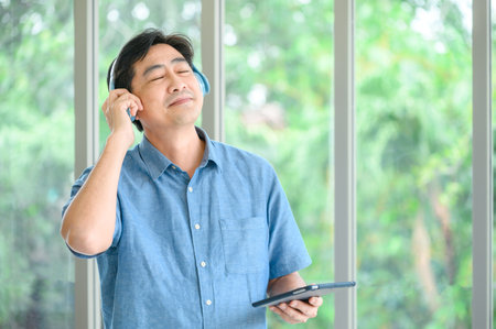 A retired elderly man spends his vacation at home listening to music. relax, restの写真素材