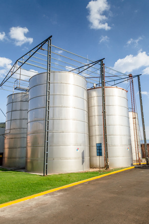 Vertical photo in color of many containers on a factory of alcoholic beveragesの写真素材