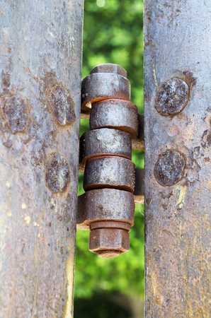 Vertical photo in color of an old iron hinge vintageの写真素材