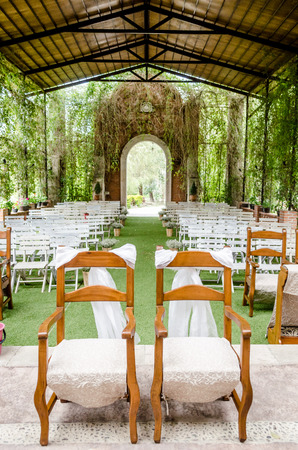 Vertical photo in color of an elegant interior about to have a wedding on a chapel or churchのeditorial素材