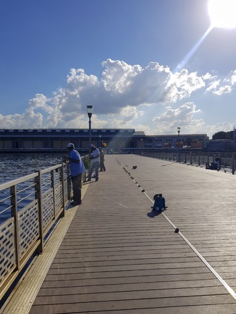 Cuban men fishing on a sunny afternoonの写真素材