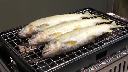 Fried fish on the grill in a restaurant in South Korea.の写真素材