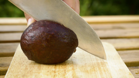 cutting an avocadoの写真素材