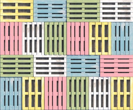 Wooden pallets of different pastel colors and shapes lie in a row in a top view. Seamless texture or background. Creative decorative illustration. 3D rendering.の写真素材