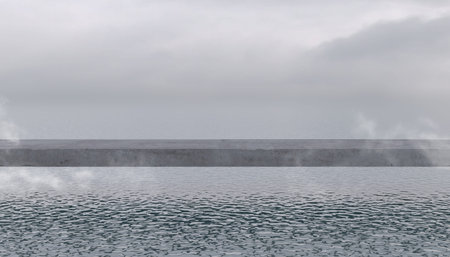 Concrete block pier above the surface of the overcast sea or ocean. Empty bridge, concrete slab or...