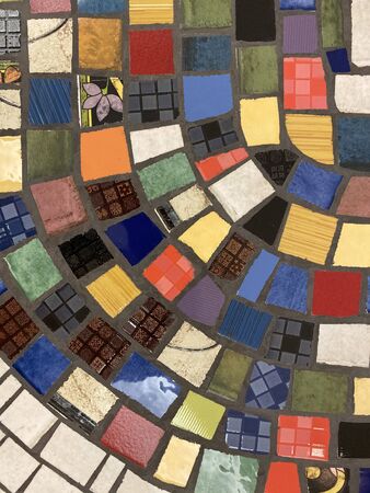 Colorful mosaic tiles texture. Patchwork chipped tiles in vintage style.の写真素材