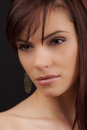 Portrait of a beautiful young romanian woman with pink lipstickの写真素材