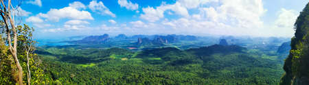 Amazing view from the top of a viewpoint, karst outcrops and blue cloudy skyの写真素材