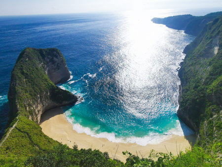 Looking down on the impressive klingking beach with the sun setting in the distance, Nusa Penida,...