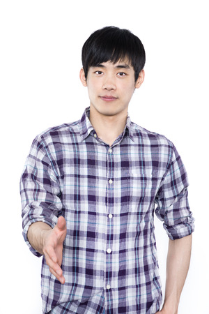 young casual man offering to shake the handの写真素材