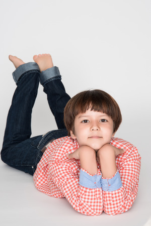 little asian boy on gray backgroundの写真素材