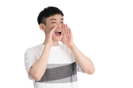 Handsome young asia man - isolated over a white backgroundの写真素材