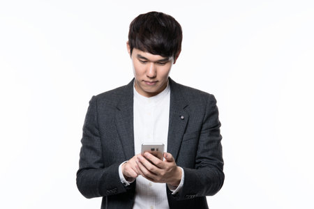 portrait of a smart young asian businessman white backgroundの写真素材