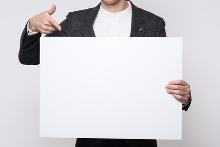 businessman arm. hand. finger gray backgroundの写真素材