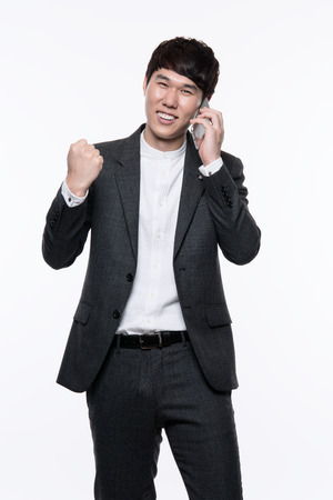 portrait of a smart young asian businessman white backgroundの写真素材