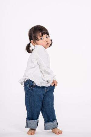 Studio portrait shot of 3-year-old Asian baby - isolatedの写真素材