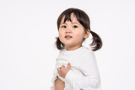 Studio portrait shot of 3-year-old Asian baby - isolatedの写真素材