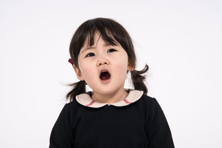 Studio portrait shot of 3-year-old Asian baby - isolated