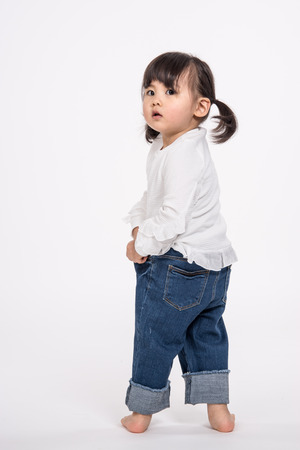 Studio portrait shot of 3-year-old Asian baby - isolatedの写真素材