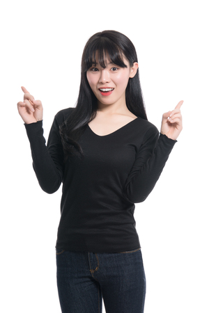 Studio portrait of twenties Asian women smiling confident and happyの写真素材