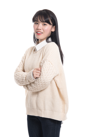 Studio portrait of twenties Asian women smiling confident and happyの写真素材