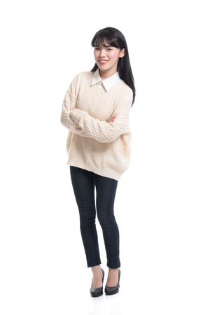 Studio portrait of twenties Asian women smiling confident and happyの写真素材