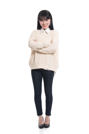 Studio portrait of twenties Asian women smiling confident and happyの写真素材