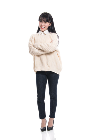Studio portrait of twenties Asian women smiling confident and happyの写真素材