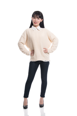 Studio portrait of twenties Asian women smiling confident and happyの写真素材