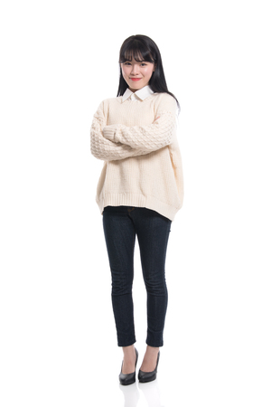 Studio portrait of twenties Asian women smiling confident and happyの写真素材