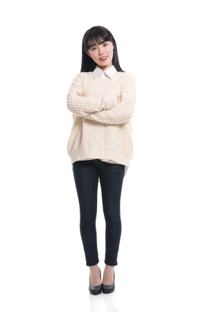 Studio portrait of twenties Asian women smiling confident and happyの写真素材