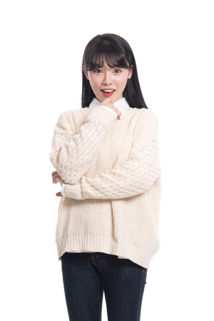 Studio portrait of happy twenties Asian womanの写真素材