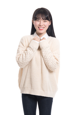 Studio portrait of happy twenties Asian womanの写真素材