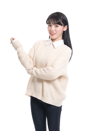 Studio portrait of happy twenties Asian womanの写真素材